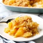 Freshly baked pineapple casserole with golden cracker topping.